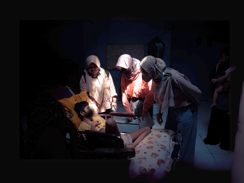 A Rachel House patient surrounded by our compassionate medical team